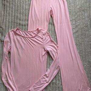 Pink matching long sleeve top and flare leggings set
